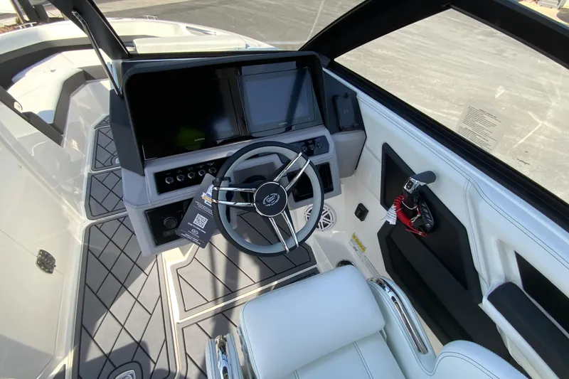 Slide: The Image of Interior view of 2026 Cobalt R6 Outboard boat cockpit with modern steering and controls. - 37