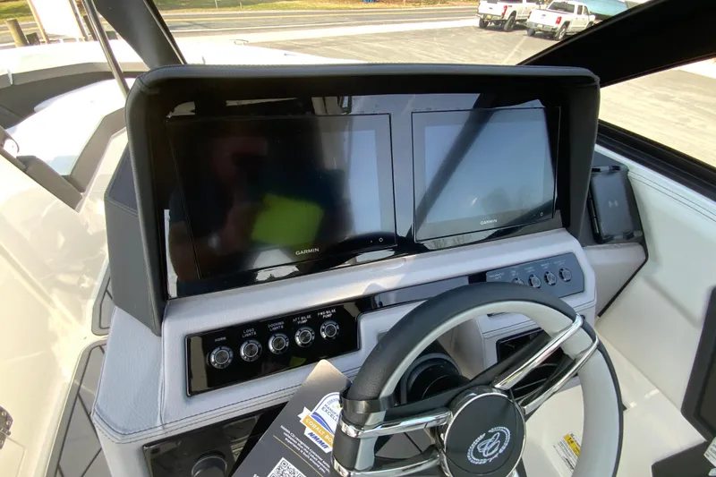 Slide: The Image of Dashboard of 2026 Cobalt R6 Outboard with dual Garmin displays and steering wheel. - 38
