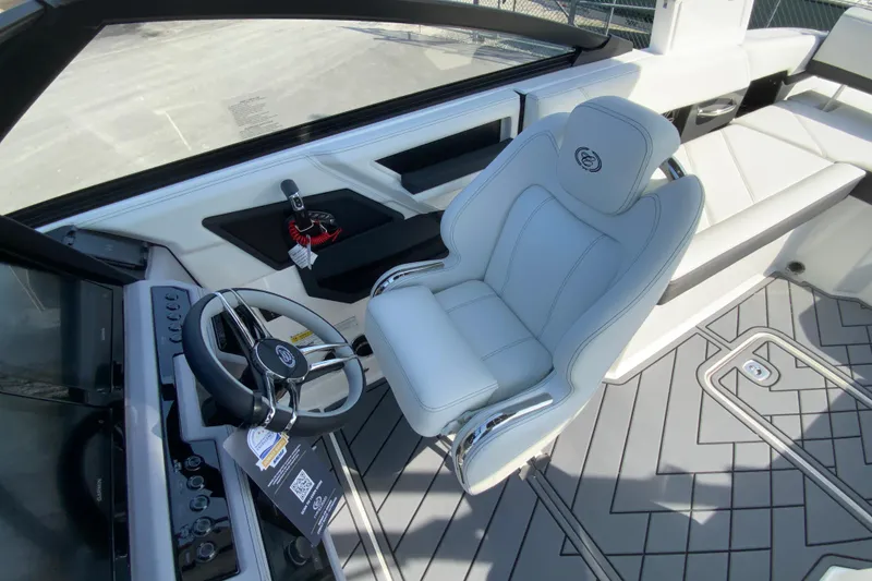 Slide: The Image of 2026 Cobalt R6 Outboard boat interior with sleek steering wheel and luxurious seating. - 42