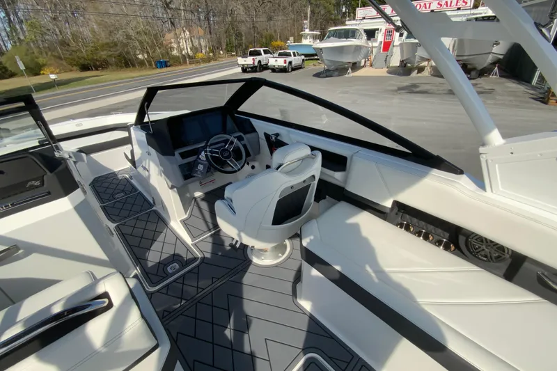 Slide: The Image of 2026 Cobalt R6 Outboard boat interior with modern helm, seating, and sleek design. - 45
