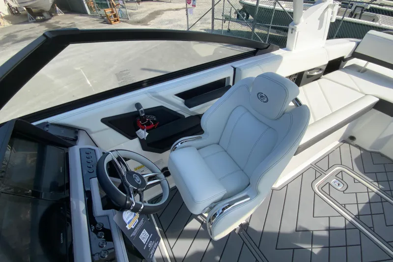 Slide: The Image of 2026 Cobalt R6 Outboard boat interior with sleek steering wheel and luxurious seating. - 46