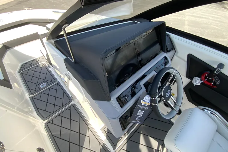 Slide: The Image of 2026 Cobalt R6 Outboard boat cockpit with modern steering and dashboard controls. - 47