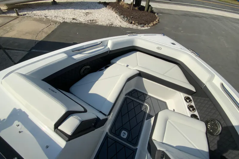 Slide: The Image of 2026 Cobalt R6 Outboard boat interior with sleek white seating and modern design. - 51