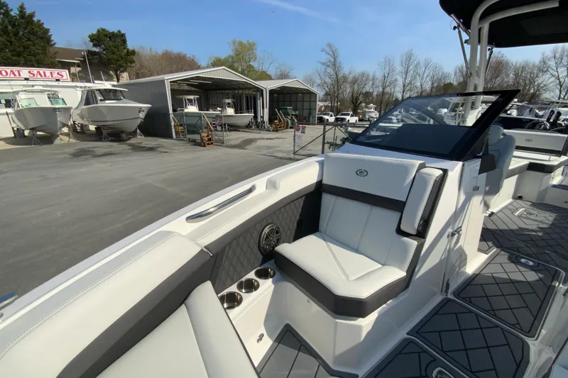 Slide: The Image of 2026 Cobalt R6 Outboard boat interior at dealership, showcasing sleek seating and modern design. - 55