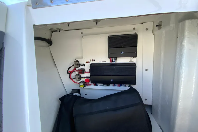 Slide: The Image of Electrical components inside a 2026 Cobalt R6 Outboard boat compartment. - 57