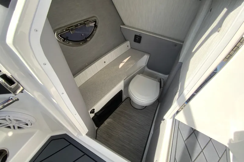 Slide: The Image of 2026 Cobalt R6 Outboard boat interior with compact bathroom and modern amenities. - 59