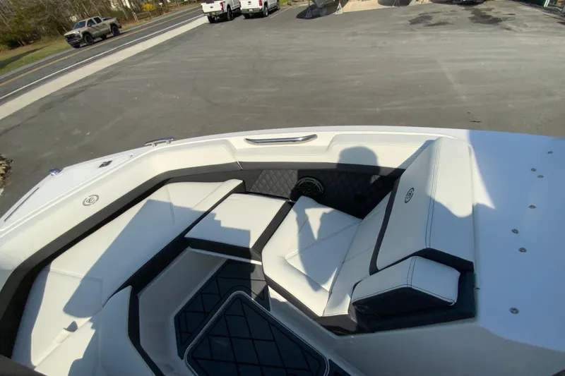 Slide: The Image of 2026 Cobalt R6 Outboard boat interior with white cushioned seating and sleek design. - 62