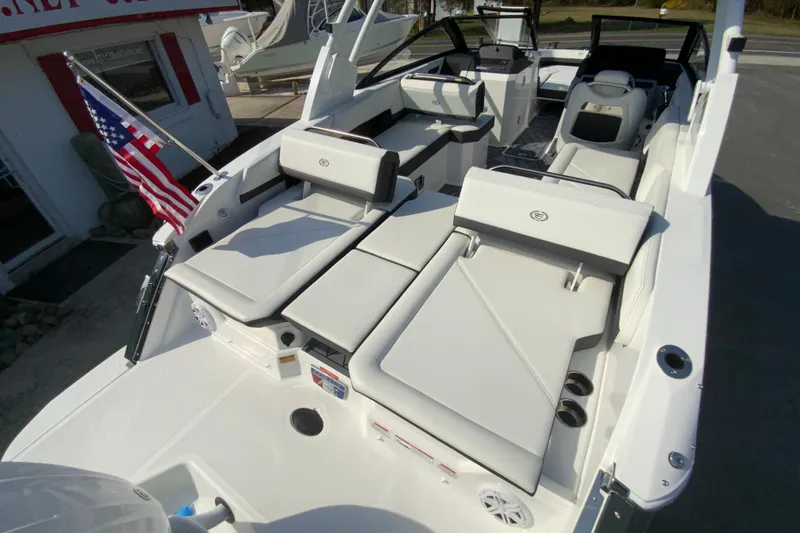 Slide: The Image of 2026 Cobalt R6 Outboard boat with luxurious seating and American flag. - 68