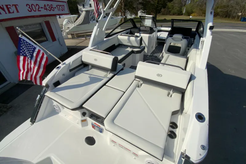 Slide: The Image of 2026 Cobalt R6 Outboard boat with spacious seating and American flag. - 70