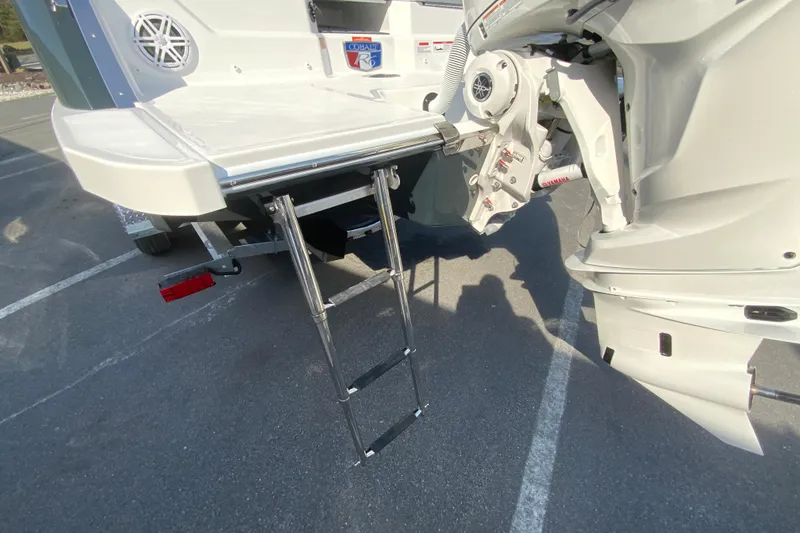 Slide: The Image of 2026 Cobalt R6 Outboard boat with extended swim ladder and Yamaha engine. - 71