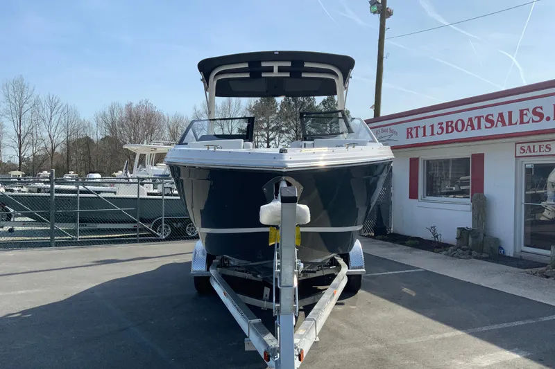 Slide: The Image of 2026 Cobalt R6 Outboard boat on trailer at dealership, sunny day. - 9