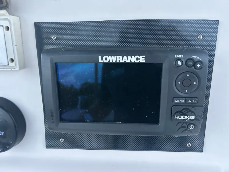 Slide: The Image of Lowrance Hook2 fish finder on 2009 Cobia 216 Center Console boat. - 6