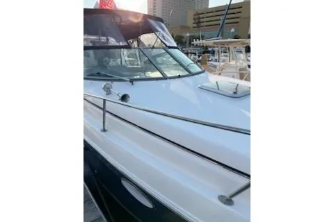 Slide: The Image of 2005 Rinker Fiesta Vee 270 boat docked at marina, side view. - 13