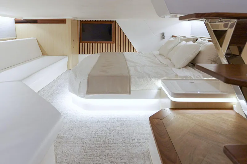 Slide: The Image of Manufacturer Provided Image: Luxurious interior of 2026 Regal 50 SAV yacht with modern design and ambient lighting. - 13