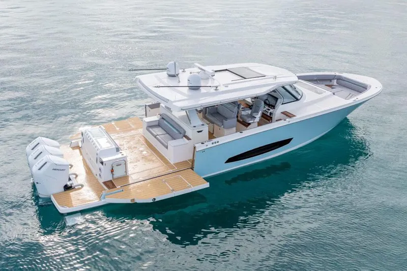 Slide: The Image of Manufacturer Provided Image: 2026 Regal 50 SAV luxury yacht on clear blue water, showcasing sleek design and modern features. - 3