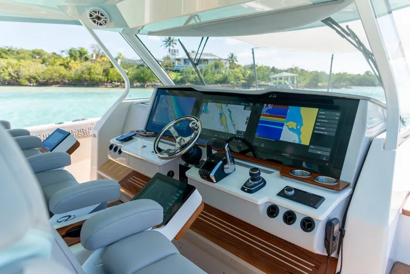 Slide: The Image of Manufacturer Provided Image: Luxurious 2026 Regal 50 SAV yacht cockpit with advanced navigation systems and plush seating. - 8