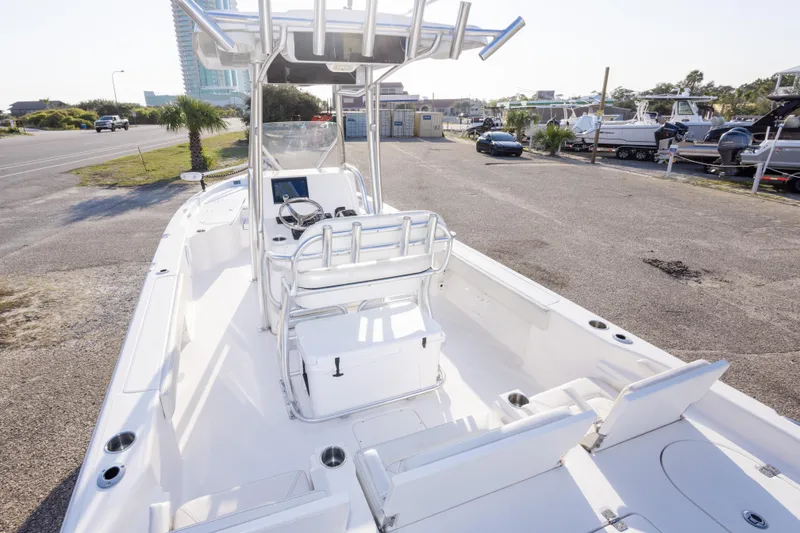 Slide: The Image of 2021 Blue Wave 2600 PureBay boat with sleek white interior and modern console design. - 11