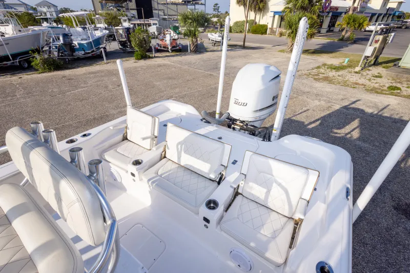 Slide: The Image of 2021 Blue Wave 2600 PureBay boat with white seating and powerful outboard motor. - 14