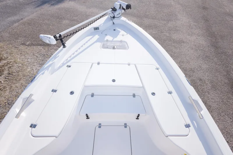 Slide: The Image of 2021 Blue Wave 2600 PureBay boat deck with storage compartments and trolling motor. - 27