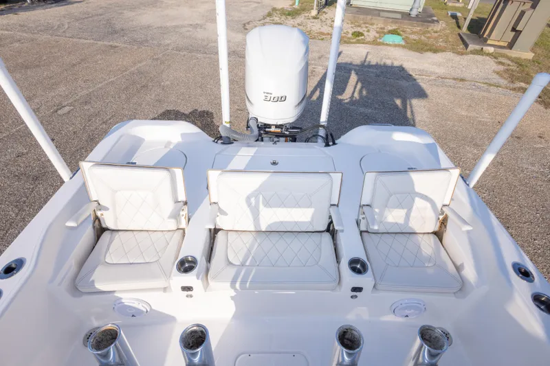 Slide: The Image of 2021 Blue Wave 2600 PureBay boat with white seating and Yamaha 300 engine. - 32