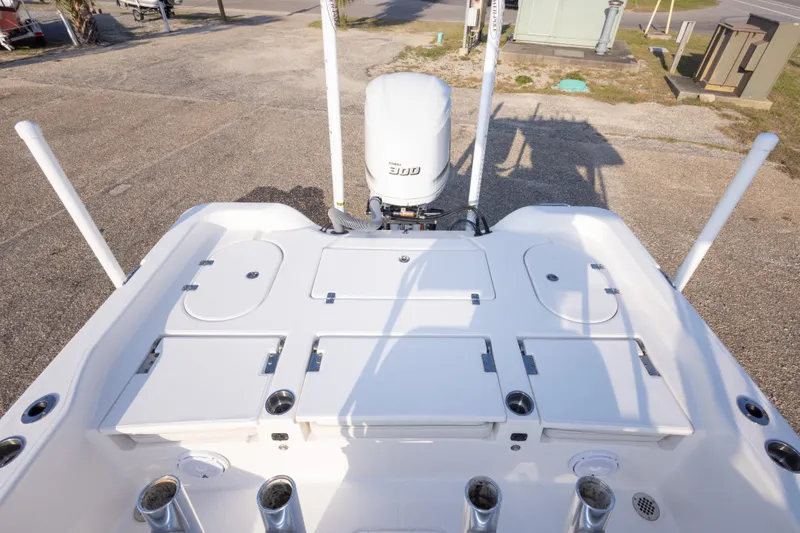 Slide: The Image of 2021 Blue Wave 2600 PureBay boat deck with storage compartments and motor. - 33