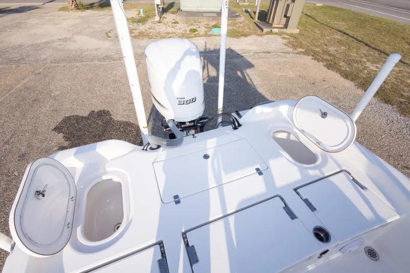 Slide: The Image of 2021 Blue Wave 2600 PureBay boat with Yamaha 300 engine, open storage compartments. - 34