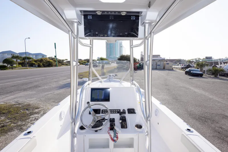 Slide: The Image of 2021 Blue Wave 2600 PureBay boat interior with steering wheel and control panel. - 35