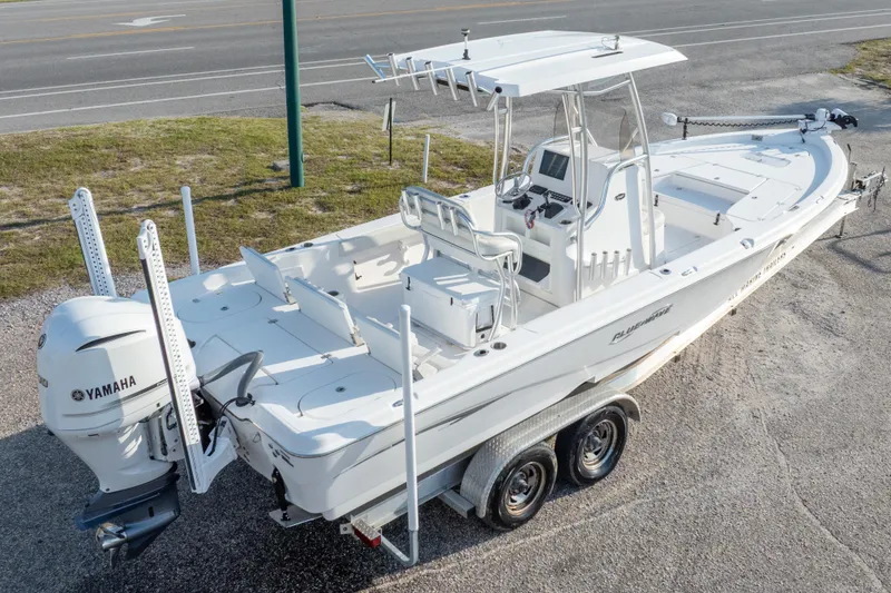 Slide: The Image of 2021 Blue Wave 2600 PureBay boat on trailer, featuring Yamaha outboard motor. - 40