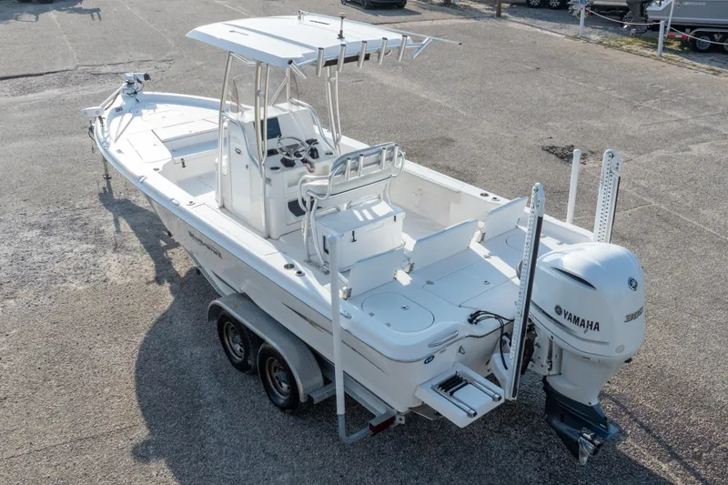 Slide: The Image of 2021 Blue Wave 2600 PureBay boat with Yamaha engine, parked on a trailer. - 42