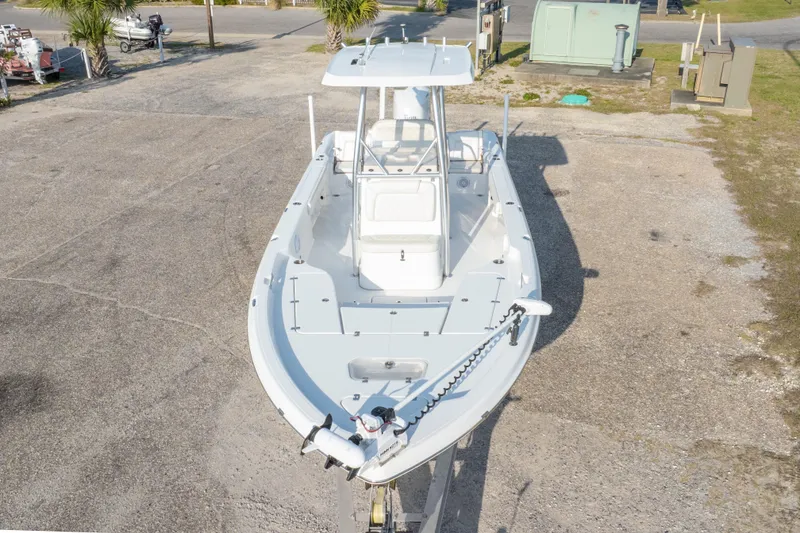 Slide: The Image of 2021 Blue Wave 2600 PureBay boat on display in a parking area. - 45