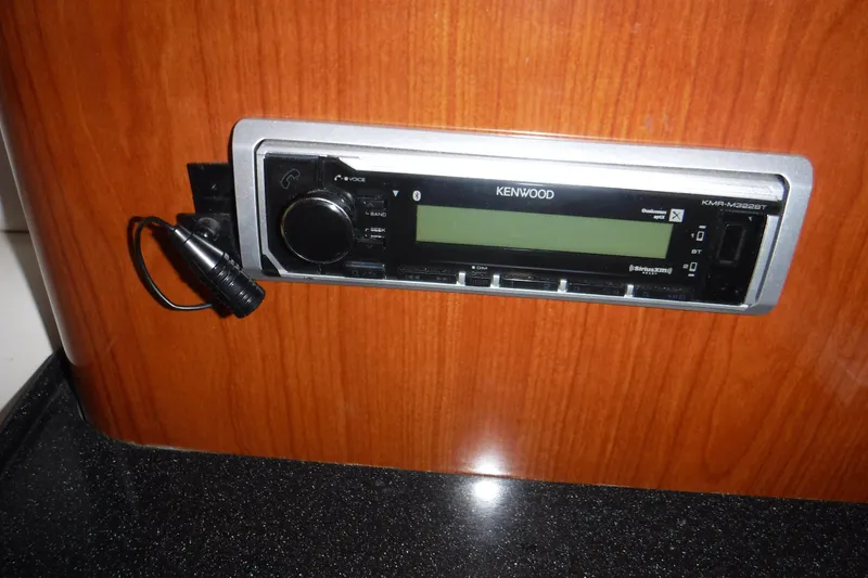Slide: The Image of Kenwood stereo system in 2006 Regal Commodore 3560 IO boat, mounted on wooden panel. - 20