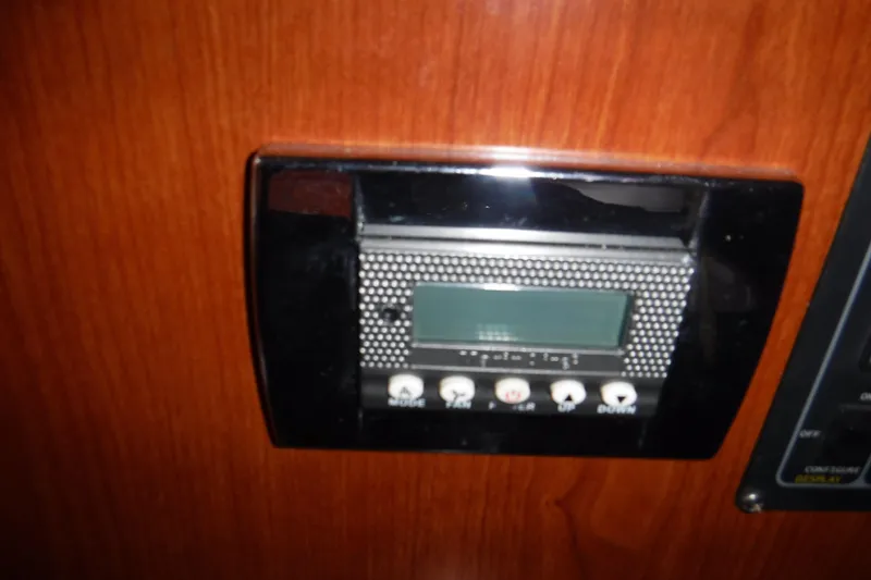 Slide: The Image of Control panel on 2006 Regal Commodore 3560 IO boat, featuring buttons and display. - 21