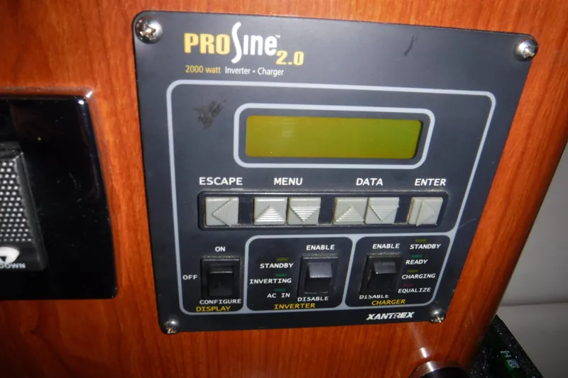 Slide: The Image of Control panel of a Xantrex PROsine 2.0 inverter charger on a 2006 Regal Commodore 3560 IO. - 22