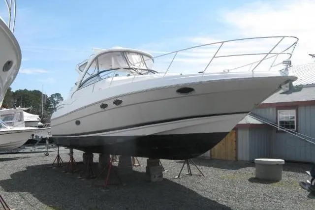 Slide: The Image of 2006 Regal Commodore 3560 yacht on stands, displayed outdoors. - 27