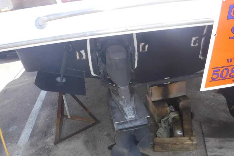 Slide: The Image of Rear view of a 2006 Regal Commodore 3560 boat with visible propeller and rudder. - 30