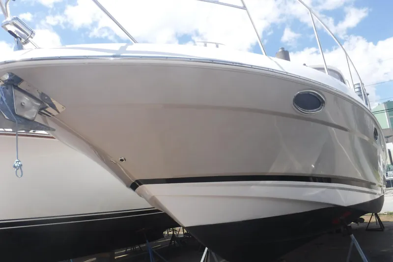 Slide: The Image of 2006 Regal Commodore 3560 yacht on display under a clear blue sky. - 32