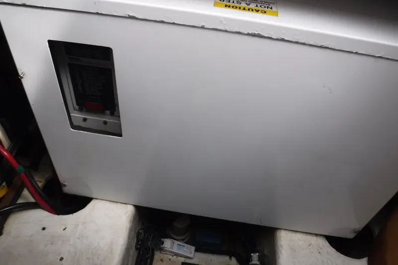 Slide: The Image of Engine compartment of 2006 Regal Commodore 3560 IO boat, featuring electrical panel and wiring. - 5