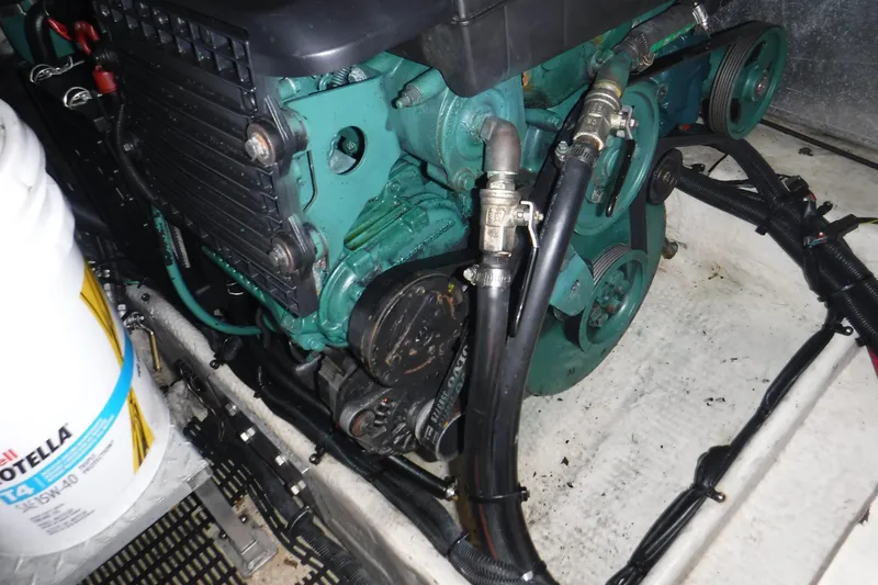 Slide: The Image of Engine compartment of a 2006 Regal Commodore 3560 IO boat, featuring mechanical components. - 6