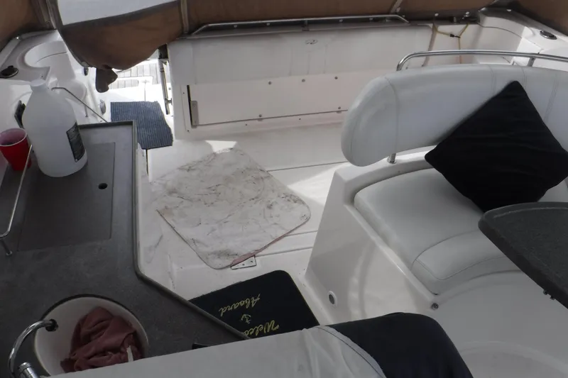 Slide: The Image of Interior of 2006 Regal Commodore 3560 IO boat with seating and kitchenette area. - 9