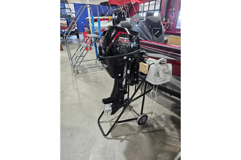 The Image of 2024 Mercury 9.9HP EFI ProKicker 4S outboard motor on display in a showroom. - 1