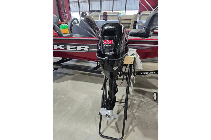 Slide: The Image of 2024 Mercury 9.9HP EFI ProKicker 4S outboard motor displayed indoors. - 2