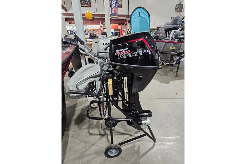 Slide: The Image of 2024 Mercury 9.9HP EFI ProKicker 4S outboard motor displayed in a showroom. - 3