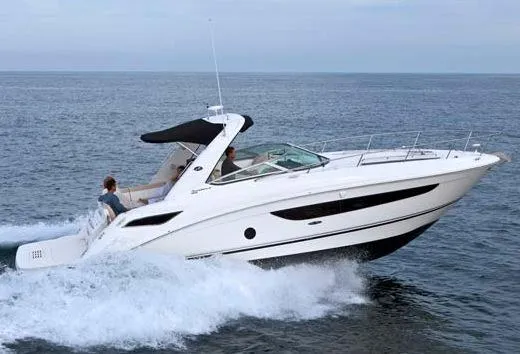 The Image of 2013 Sea Ray Sundancer 350 docked with city skyline backdrop. - 0