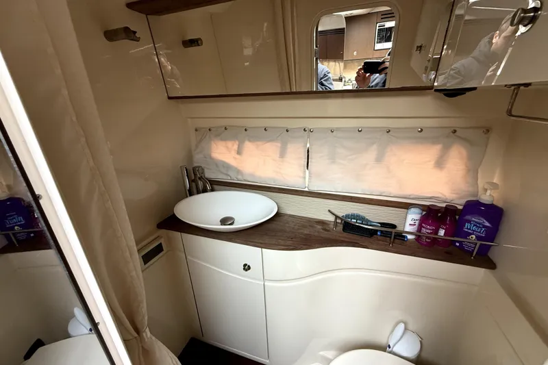 Slide: The Image of Luxurious bathroom interior of 2013 Sea Ray Sundancer 350 yacht with modern fixtures. - 17