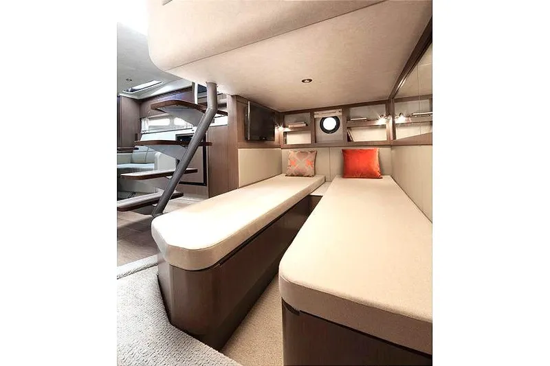 Slide: The Image of Manufacturer Provided Image: Interior cabin of 2013 Sea Ray 350 Sundancer with beige seating and modern design. - 19