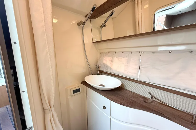 Slide: The Image of Bathroom interior of 2013 Sea Ray Sundancer 350 yacht with modern sink and shower. - 20