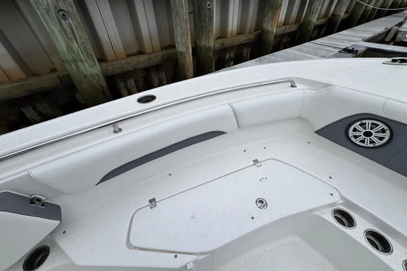 Slide: The Image of 2018 Tidewater 252 LXF boat interior with seating and speaker detail. - 14