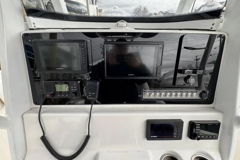 Slide: The Image of Dashboard of a 2018 Tidewater 252 LXF boat with Garmin navigation systems. - 6