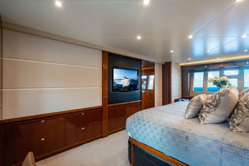 Slide: The Image of Luxurious bedroom interior of 2010 Princess 95 Motor Yacht with elegant decor and ocean view. - 100