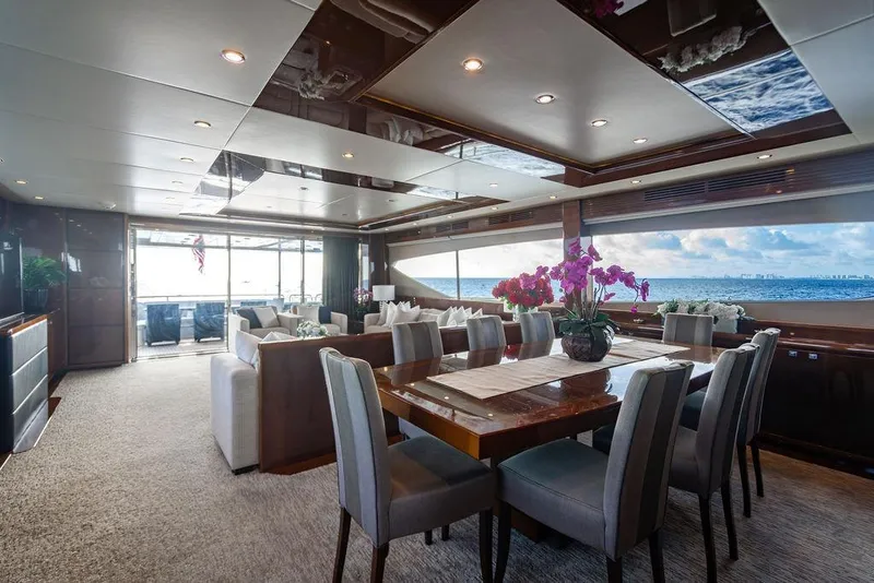 Slide: The Image of Luxurious interior of 2010 Princess 95 Motor Yacht with ocean view and elegant dining area. - 12